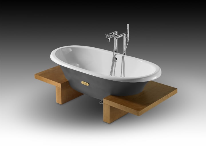 Woodline freestanding cast iron bath with cherry-wood floorboards