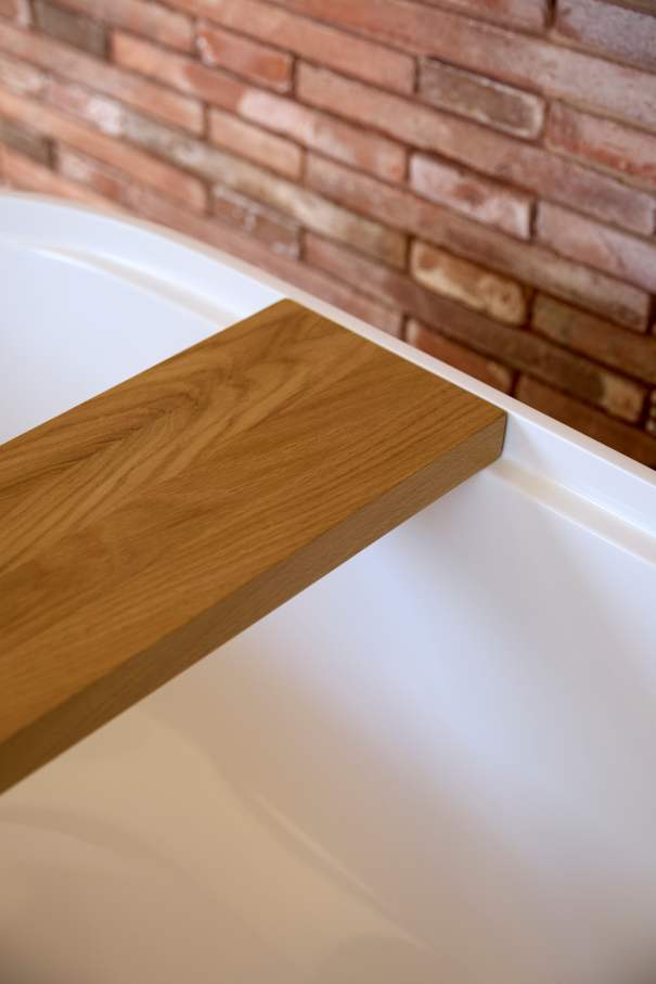 The layout of Casa IV transforms the bathroom into a fluid part of the living space, enhancing the overall living experience. The integration of the Tura bath, WC, and over-countertop basin creates a sense of calm and sophistication, while the Nu Stripes faucet introduces a dynamic element. The bath transcends the functional, becoming a focal point in the bedroom and a symbol of the essence of Mediterranean living. This home is an example of how Roca's products enrich the living experience, creating a seamless blend of functionality and design, in keeping with the project's philosophy of understated elegance and thoughtful detail.23