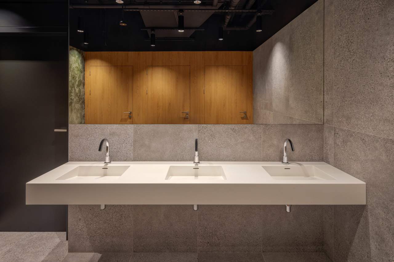 Sustainability is central to The Bridge's identity. Certified BREEAM Excellent, WELL Gold, WELL Health Safety, SmartScore and WiredScore — the first commercial property in Central and Eastern Europe to achieve the latter two. Roca delivered bathroom solutions that adhered to the high-standards of sustainability and echo the building's architectural character. Shared spaces feature water-saving L-30 Electronic faucets with Access wall-hung basins, toilets and grab bars, and client office bathrooms include L-20 Electronic faucets. Refined and timeless, the bathrooms are built for longevity — making Roca the ideal partner for this unique blend of heritage and contemporary design.5